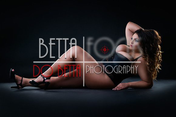 Plus size sexy model in swimsuit, fat woman on black studio background, overweight female body